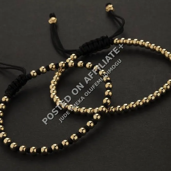 gold and black bracelet bead